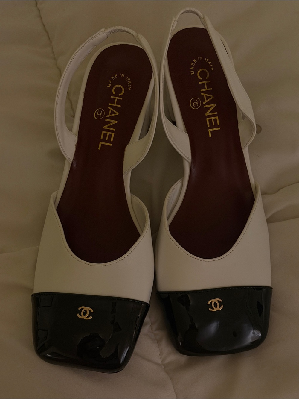 White and Black Slingback Pumps